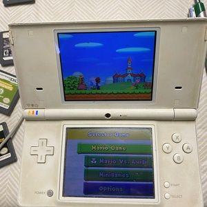 Nintendo DSi, charger, 14 games & case